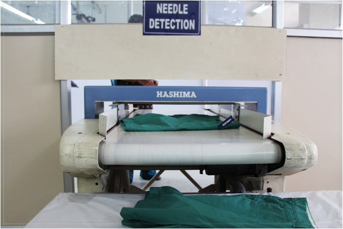 NEEDLE DETECTOR MACHINE:-	<br/>									
This machine is used specially at all manufacturing units to detect needles <br /> or other metals that could accidently get										
embedded in the cloth.  Each garment<br /> is made to pass through this machine before getting packed into cartons										
thus ensuring <br /> shipping of needle free products
